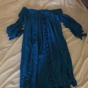 A blue off the shoulder dress.
